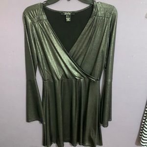 A women’s gray, shiny silver like dress.